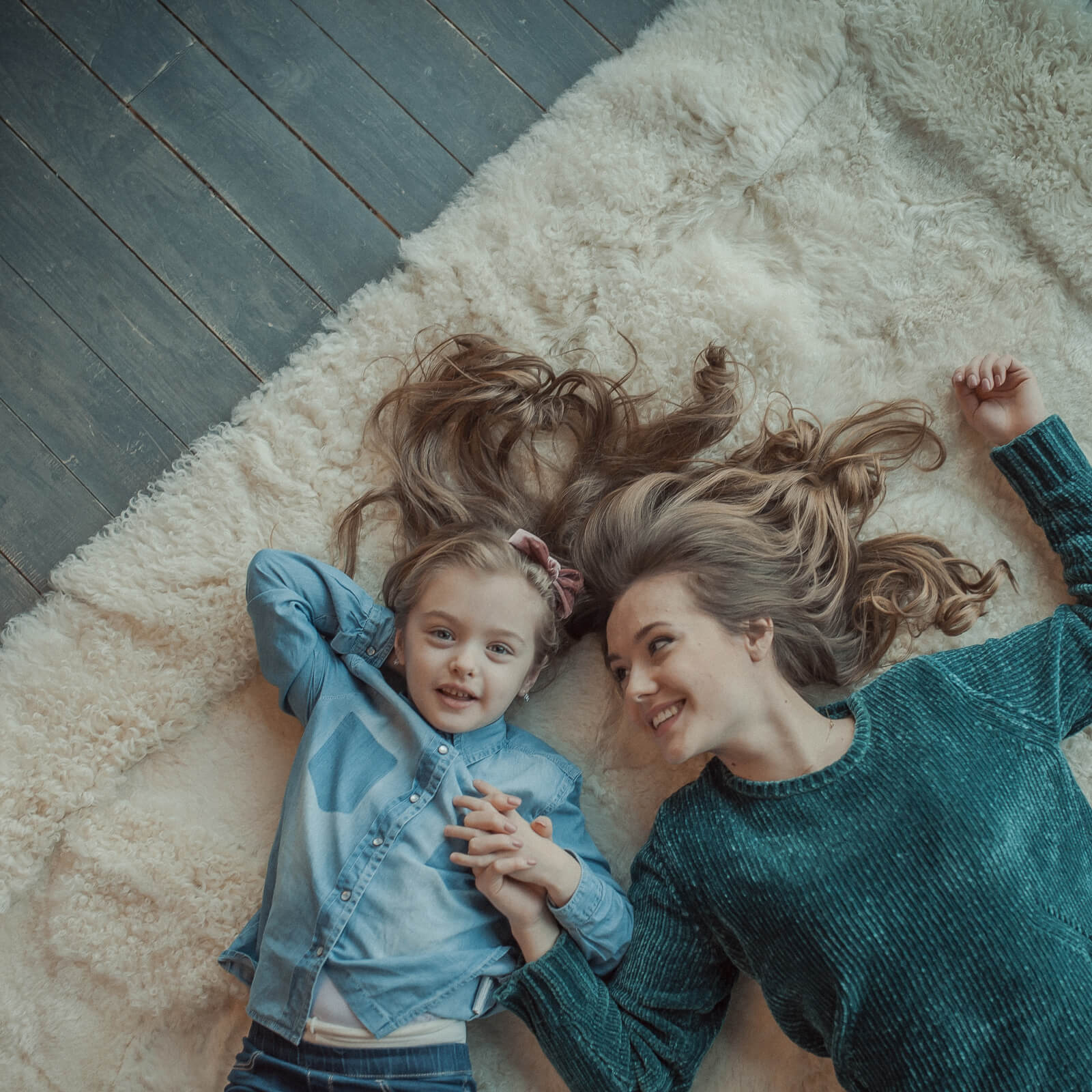 Mom and baby on area rug | Floors by Roberts